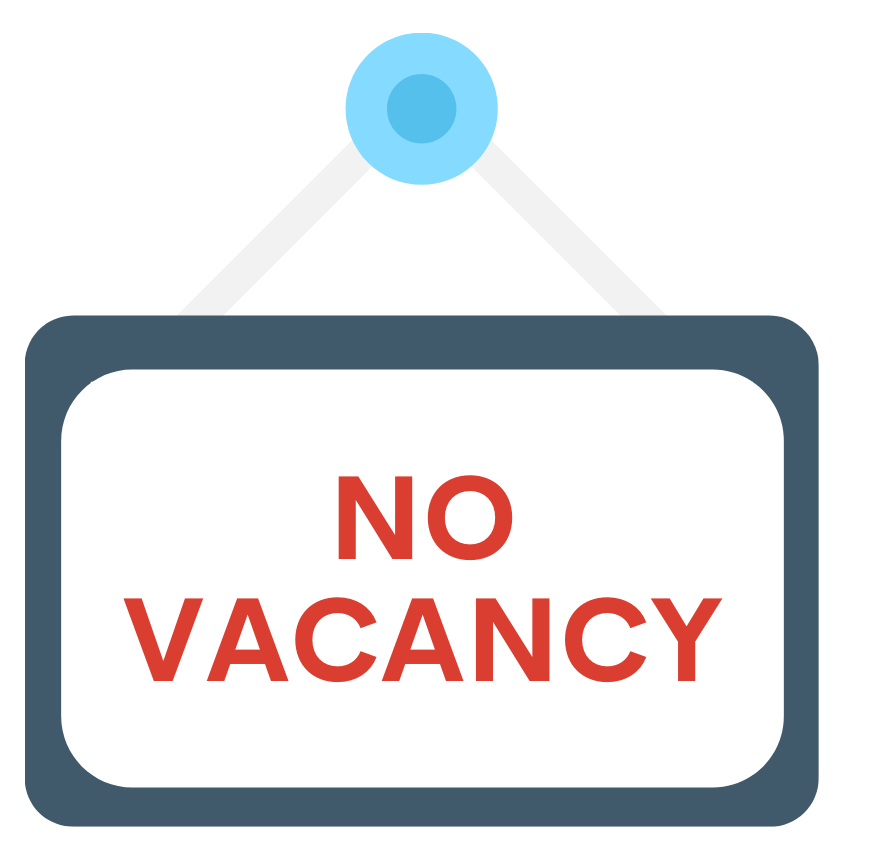 A sign hanging from a peg reads "No Vacancy."